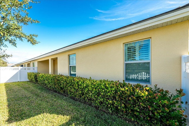 view of home's exterior featuring a yard