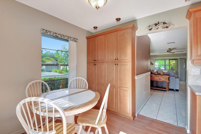 dining room featuring ceiling fan and light wood-type flooring