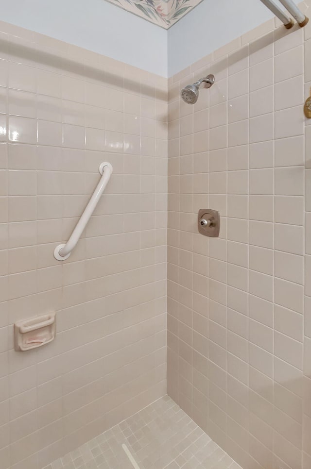 bathroom with a tile shower