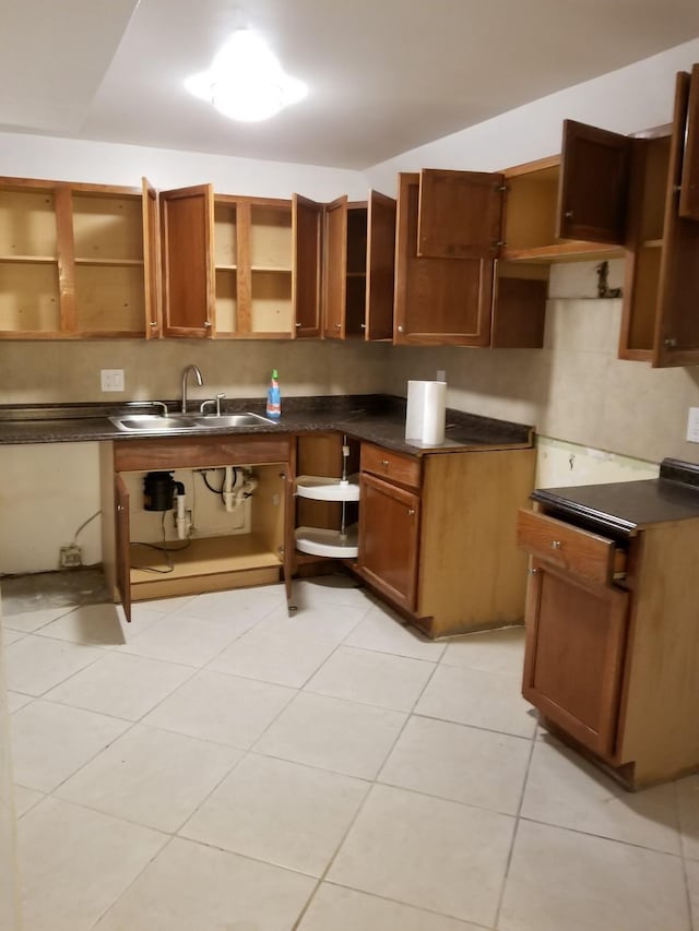 kitchen with sink and light tile patterned floors