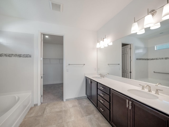 bathroom featuring vanity and shower with separate bathtub