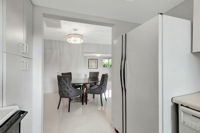 dining room featuring a notable chandelier