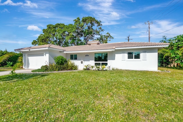 single story home featuring a front yard and a garage