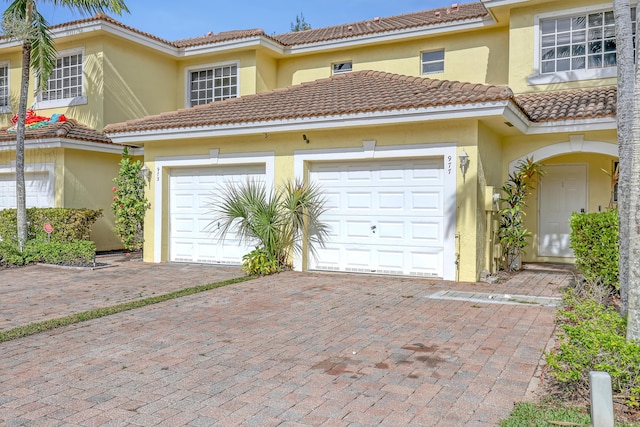 mediterranean / spanish-style house featuring a garage