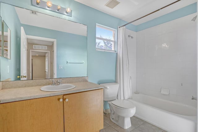 full bathroom with tile patterned floors, vanity, toilet, and shower / bath combo with shower curtain