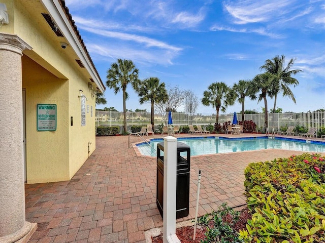 view of pool featuring a patio