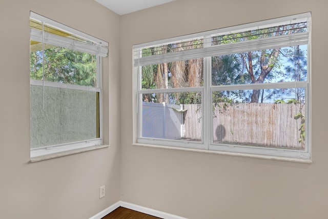 spare room featuring dark hardwood / wood-style floors