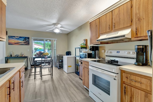 kitchen featuring ceiling fan, light wood-type flooring, a textured ceiling, fridge, and white electric range oven