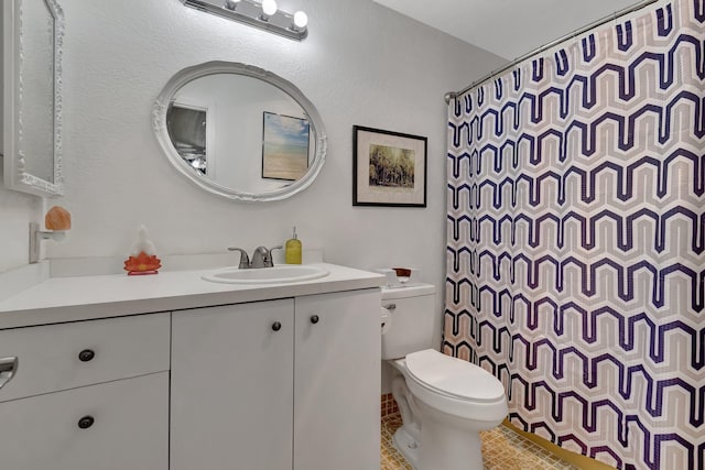 bathroom featuring walk in shower, tile patterned flooring, vanity, and toilet