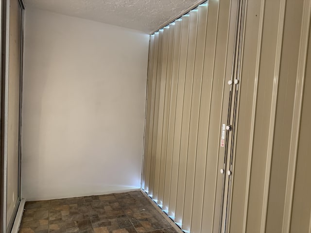 interior space featuring a textured ceiling