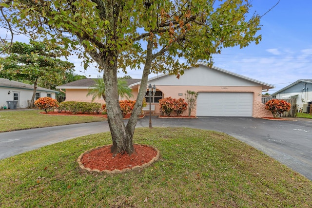 ranch-style home with a front yard and a garage