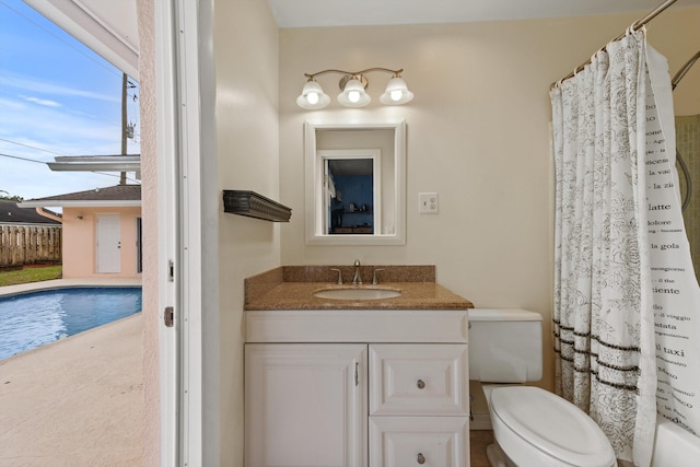 full bathroom featuring shower / bath combination with curtain, vanity, and toilet