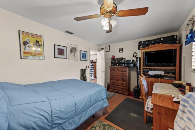 bedroom featuring ceiling fan and hardwood / wood-style flooring