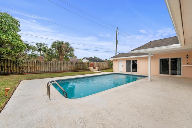 view of swimming pool with a patio area