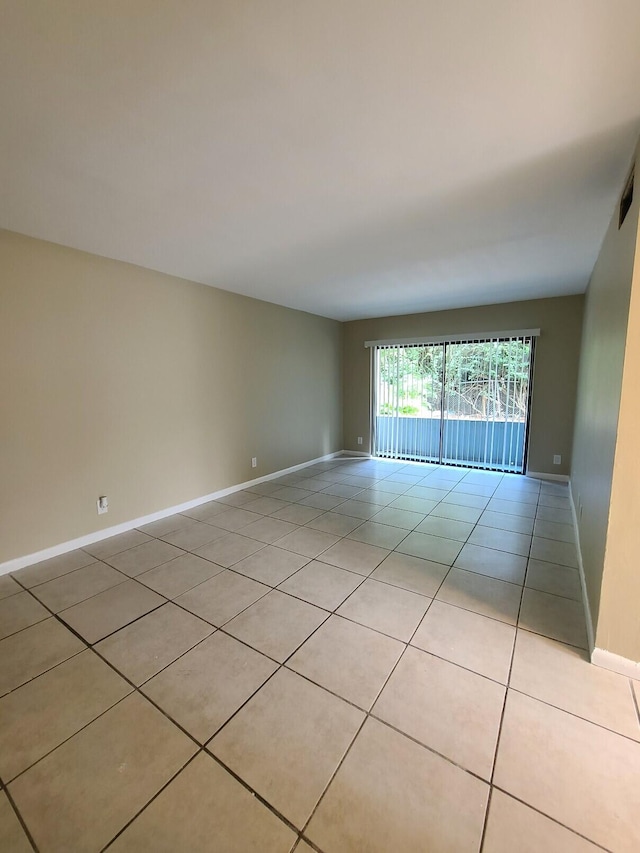 empty room with light tile patterned flooring