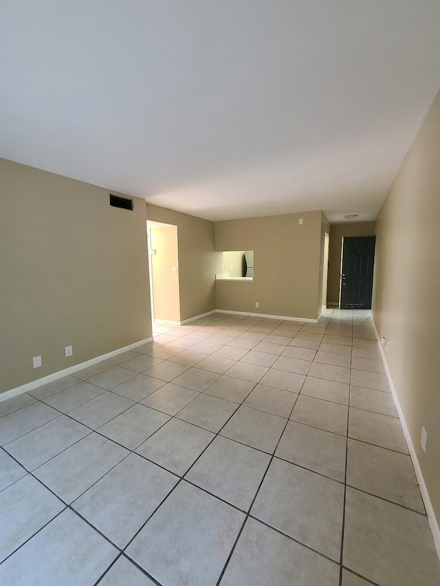 spare room with light tile patterned flooring