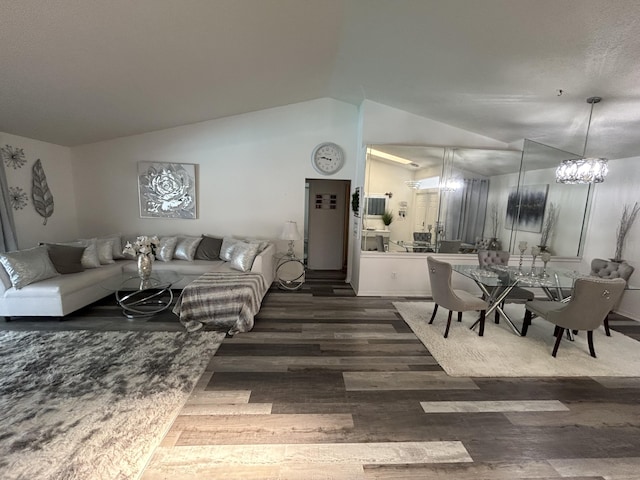 living room featuring dark hardwood / wood-style flooring and vaulted ceiling