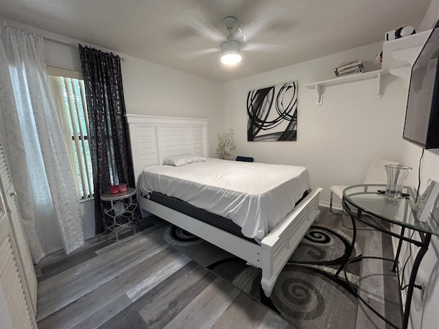 bedroom featuring ceiling fan and hardwood / wood-style flooring