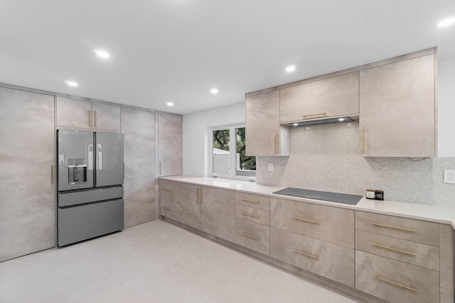 kitchen with backsplash, stainless steel fridge with ice dispenser, and black electric stovetop