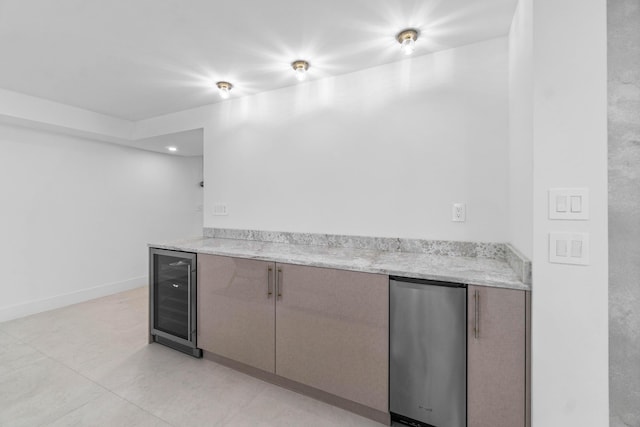 bar featuring wine cooler, light tile patterned flooring, and fridge