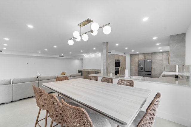 dining area with a tile fireplace