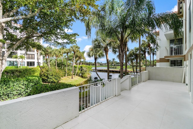 view of patio with a water view