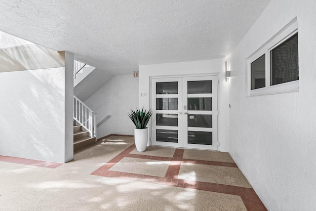 view of exterior entry featuring french doors