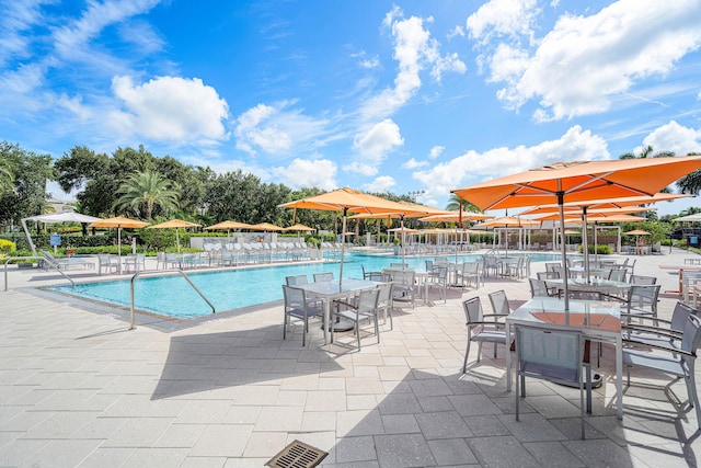 view of swimming pool featuring a patio