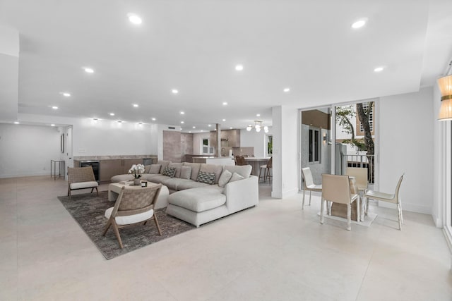 living room with floor to ceiling windows and beverage cooler