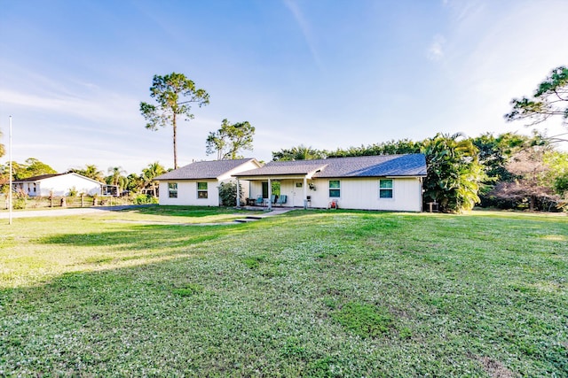 ranch-style house with a front lawn