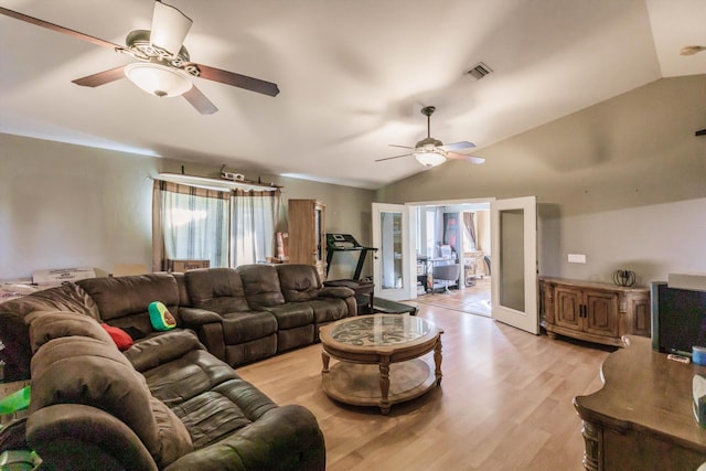 living room with french doors, light wood-type flooring, vaulted ceiling, and ceiling fan