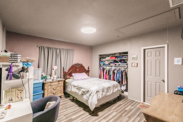 bedroom featuring a closet and light hardwood / wood-style floors