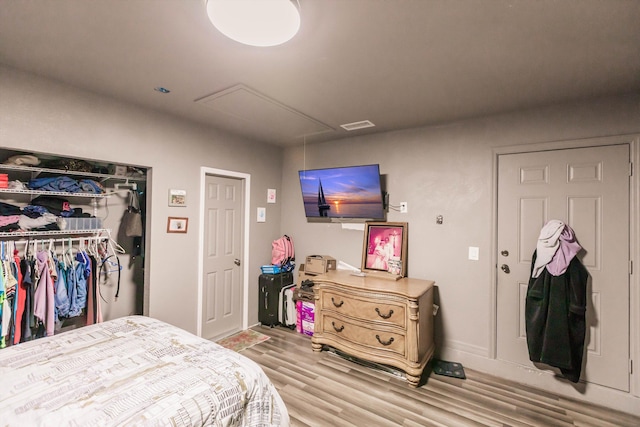 bedroom featuring light hardwood / wood-style flooring and a closet