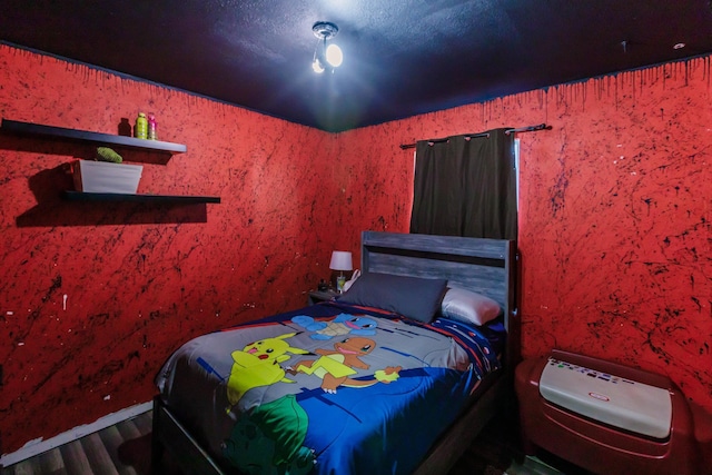 bedroom featuring wood-type flooring