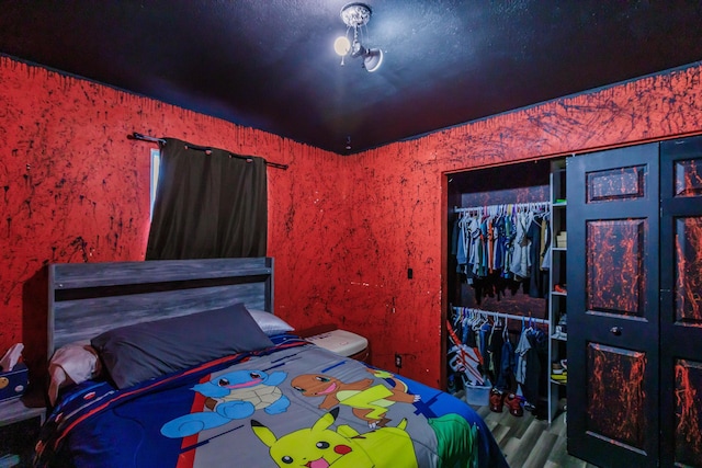 bedroom featuring a closet and hardwood / wood-style flooring