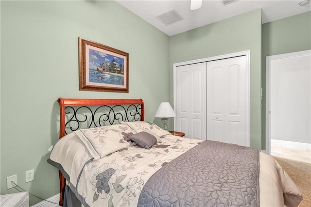 bedroom with ceiling fan and a closet