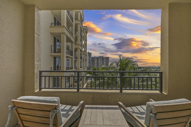 view of balcony at dusk