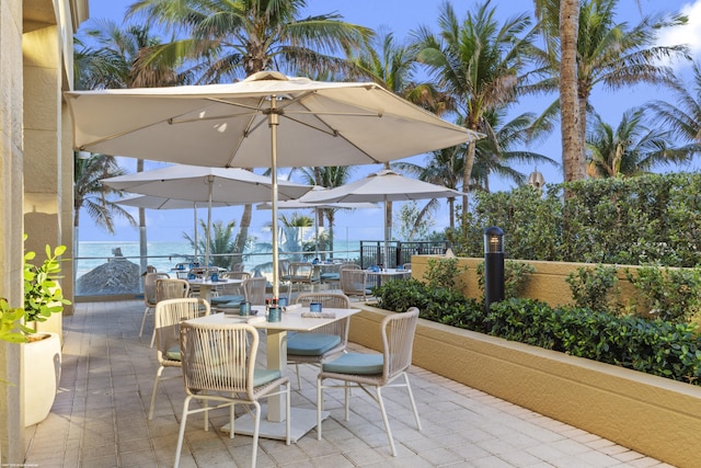 view of patio featuring a water view