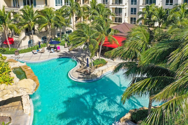 view of swimming pool featuring a patio and pool water feature