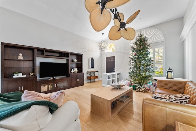 living room with light hardwood / wood-style flooring and ceiling fan