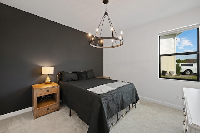 carpeted bedroom featuring a chandelier