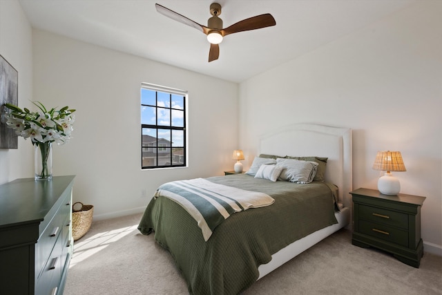 bedroom with ceiling fan and light colored carpet