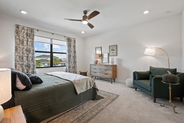 bedroom featuring light carpet and ceiling fan