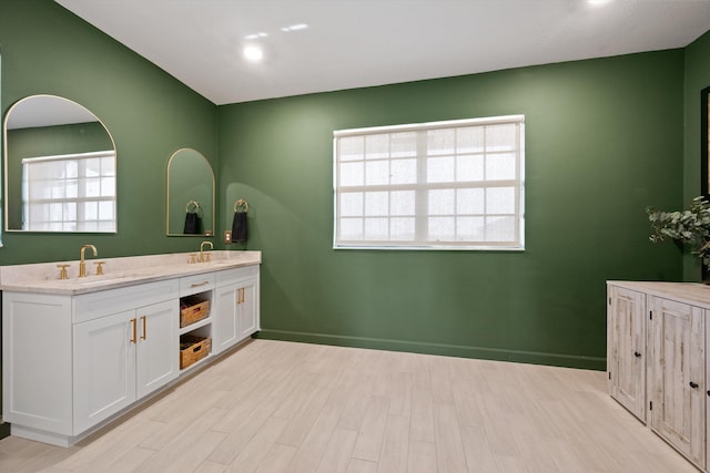 bathroom with vanity and hardwood / wood-style floors