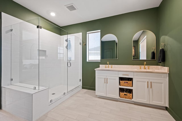 bathroom with vanity and an enclosed shower