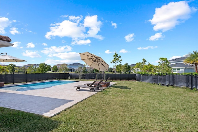 view of pool featuring a lawn and a patio area