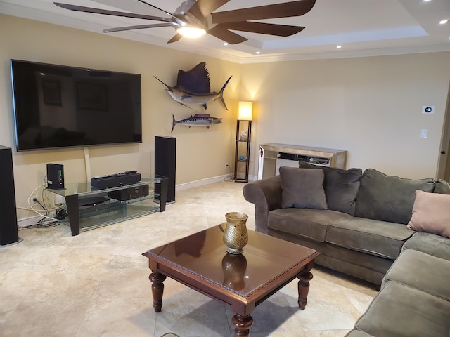 living room with crown molding and a tray ceiling