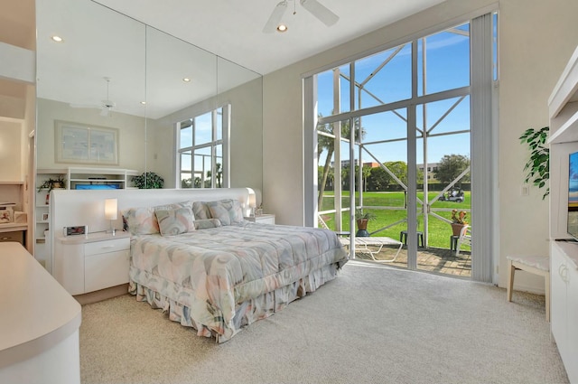 bedroom with ceiling fan, light carpet, and access to outside