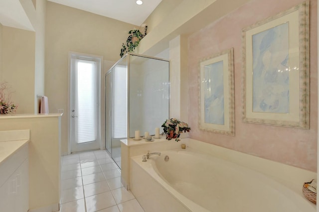 bathroom with tile patterned floors, plus walk in shower, and vanity