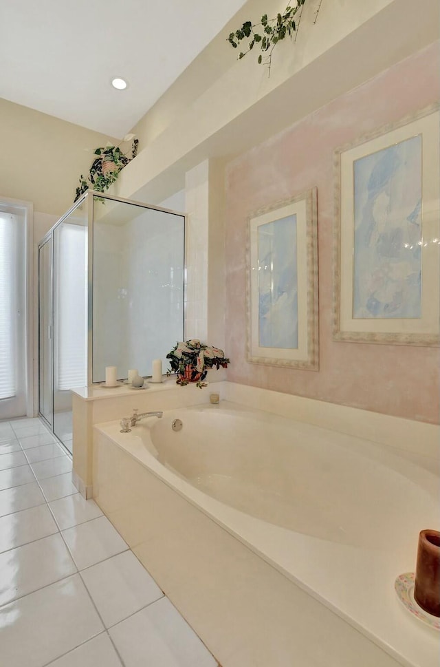 bathroom with tile patterned flooring and plus walk in shower